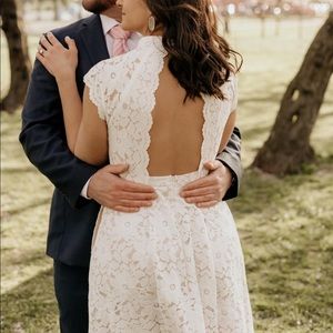 Beautiful white lace dress with nude under layer. Maxi high low length